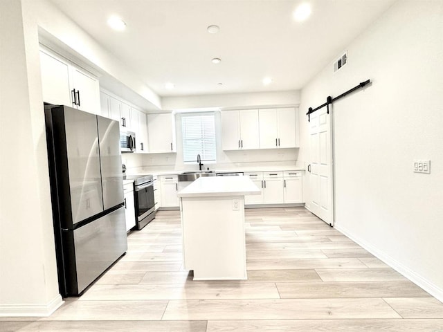 3507 Sequoia St, Lemon Grove, CA 91945 - kitchen featuring light countertops, stainless steel appliances, recessed lighting, and white cabinetry