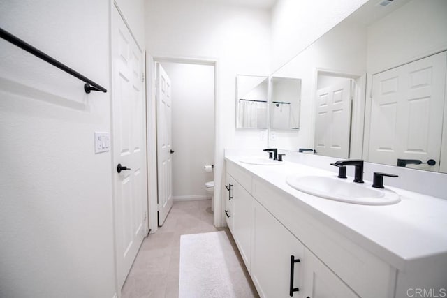 3507 Sequoia St, Lemon Grove, CA 91945 - full bath with double vanity, toilet, baseboards, and a sink
