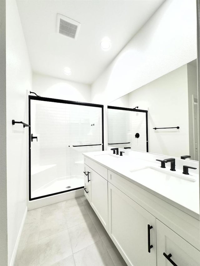 3507 Sequoia St, Lemon Grove, CA 91945 - bathroom featuring visible vents, double vanity, baseboards, a sink, and a stall shower