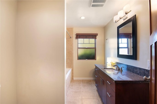 bathroom with visible vents, tile patterned floors, baseboards, vanity, and recessed lighting