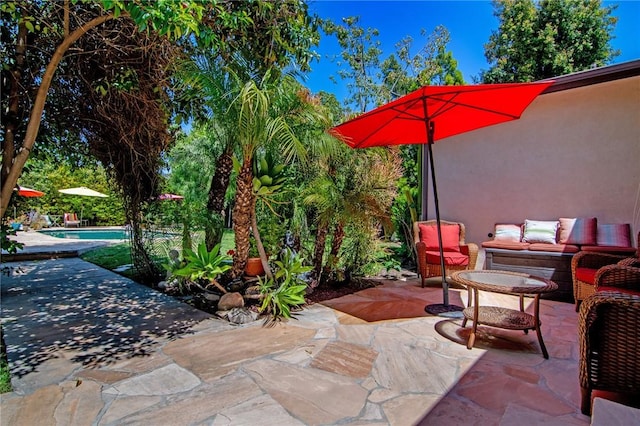 view of patio featuring an outdoor living space and an outdoor pool