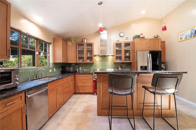 kitchen featuring wall chimney range hood, dishwasher, a sink, refrigerator with ice dispenser, and lofted ceiling