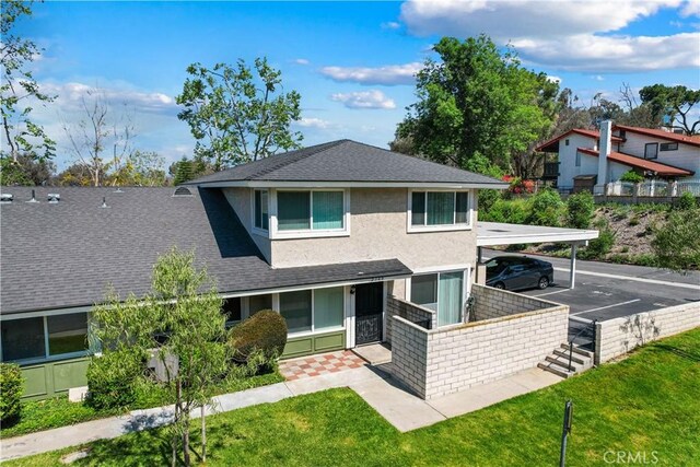 2148 Eveningside Dr, West Covina, CA 91792 - view of front of property featuring a shingled roof, stucco siding, uncovered parking, and a front lawn