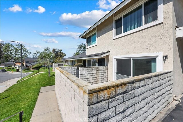 2148 Eveningside Dr, West Covina, CA 91792 - view of side of property with a lawn and stucco siding
