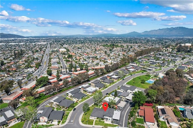 birds eye view of property with a residential view and a mountain view