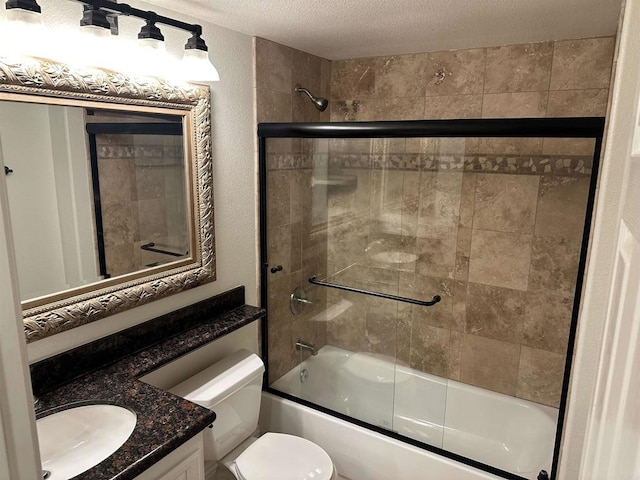 full bath with toilet, a textured ceiling, enclosed tub / shower combo, and vanity