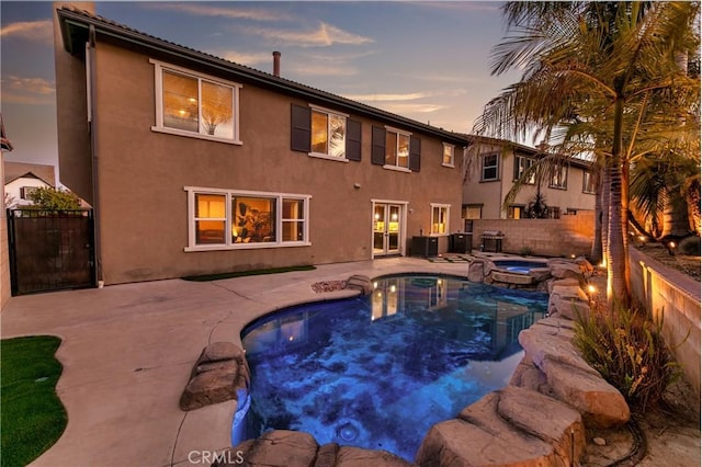 13744 Star Ruby Ave, Eastvale, CA 92880 - view of swimming pool with a fenced backyard, a patio area, and a pool with connected hot tub