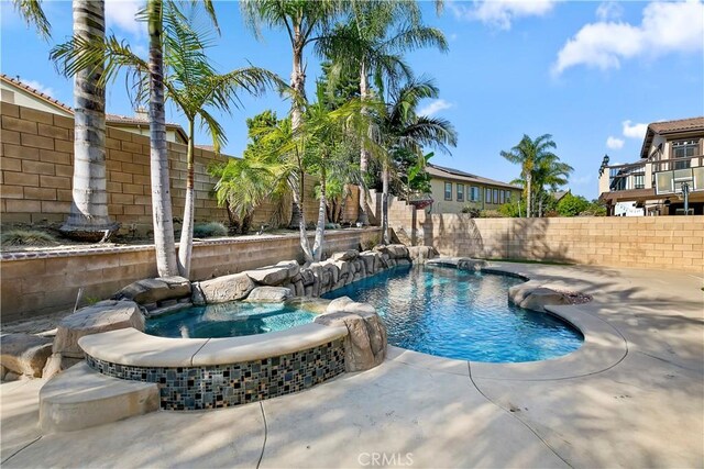 13744 Star Ruby Ave, Eastvale, CA 92880 - view of swimming pool featuring a fenced backyard and a pool with connected hot tub