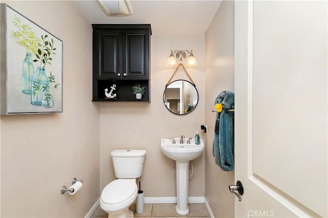 13744 Star Ruby Ave, Eastvale, CA 92880 - bathroom with toilet, baseboards, and tile patterned floors
