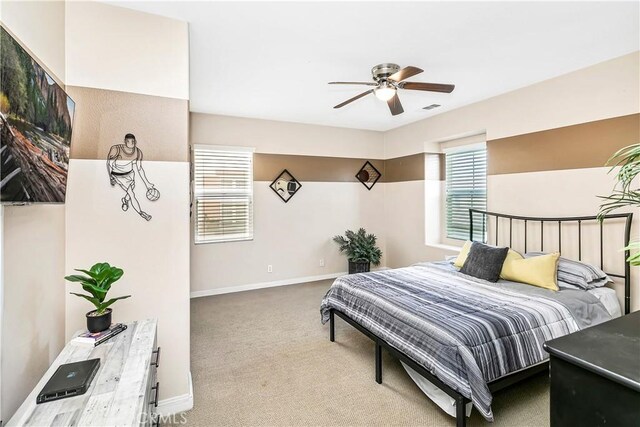 13744 Star Ruby Ave, Eastvale, CA 92880 - bedroom featuring carpet floors, a ceiling fan, baseboards, and visible vents