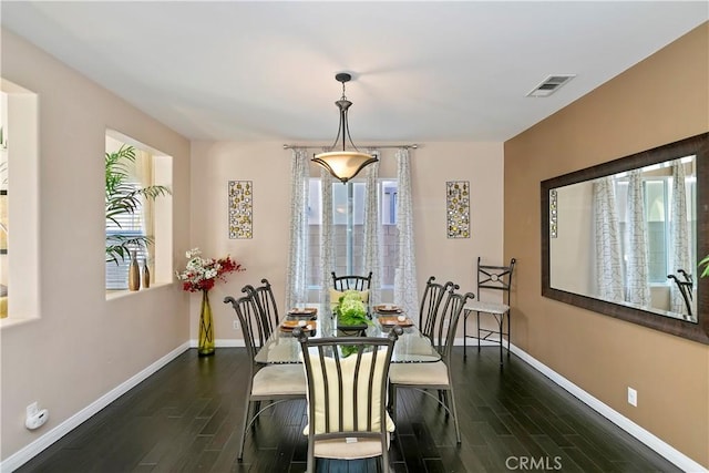 13744 Star Ruby Ave, Eastvale, CA 92880 - dining area with baseboards, wood finished floors, and visible vents