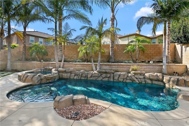 13744 Star Ruby Ave, Eastvale, CA 92880 - view of pool featuring a fenced backyard, a fenced in pool, and an in ground hot tub
