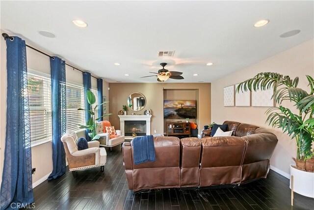 13744 Star Ruby Ave, Eastvale, CA 92880 - living room with dark wood-style flooring, baseboards, visible vents, and a ceiling fan