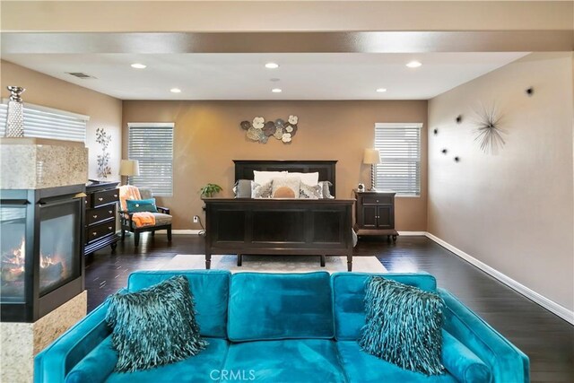 13744 Star Ruby Ave, Eastvale, CA 92880 - interior space featuring baseboards, plenty of natural light, wood finished floors, and visible vents
