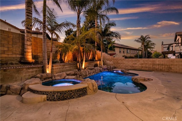 13744 Star Ruby Ave, Eastvale, CA 92880 - view of swimming pool with a patio, a fenced backyard, and a pool with connected hot tub