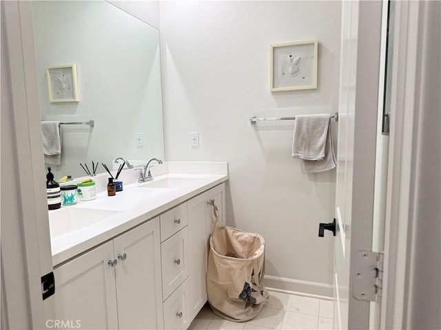 3530 E Delight Paseo Unit 205, Ontario, CA 91761 - bathroom featuring double vanity, baseboards, and tile patterned floors