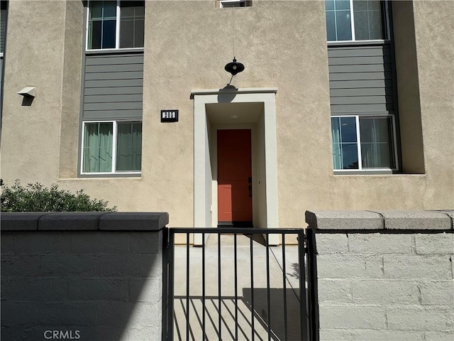 3530 E Delight Paseo Unit 205, Ontario, CA 91761 - doorway to property with stucco siding
