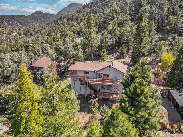 bird's eye view with a wooded view and a mountain view