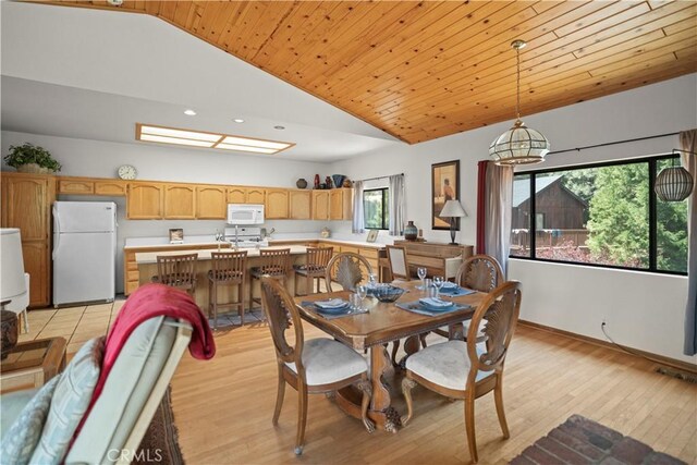 dining space with light wood-type flooring, wooden ceiling, baseboards, lofted ceiling, and recessed lighting