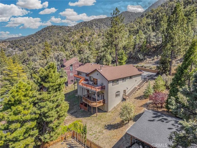 aerial view featuring a mountain view and a wooded view