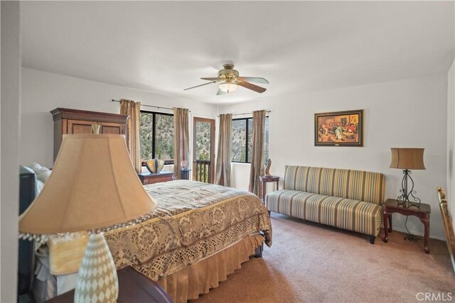 carpeted bedroom featuring ceiling fan and baseboards