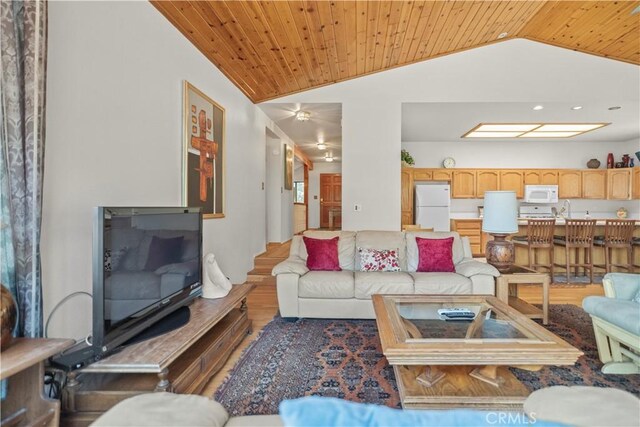 living room with wood ceiling, wood finished floors, and vaulted ceiling