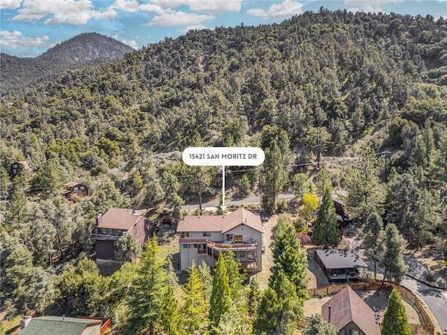 aerial view with a forest view and a mountain view