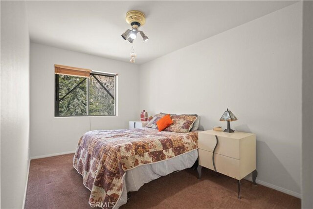 carpeted bedroom with baseboards