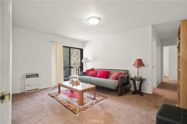 living room with carpet floors and heating unit