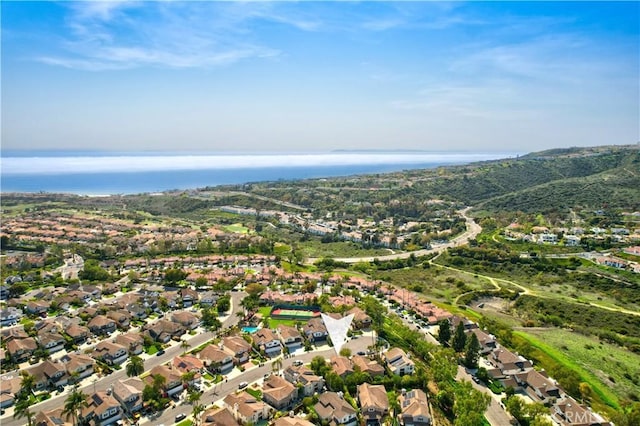 aerial view with a water and mountain view and a residential view