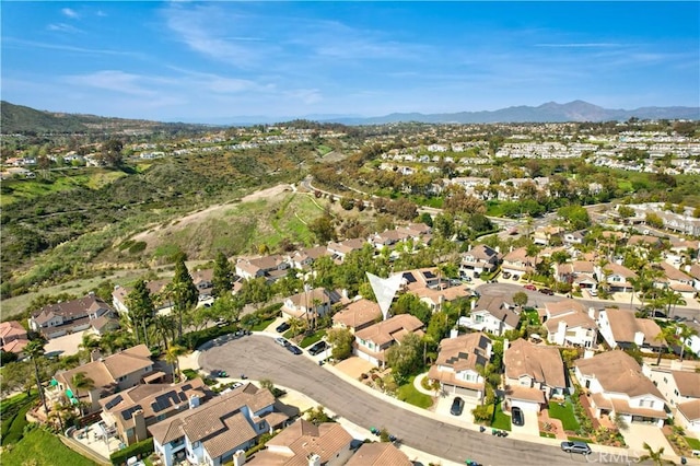 birds eye view of property with a mountain view and a residential view