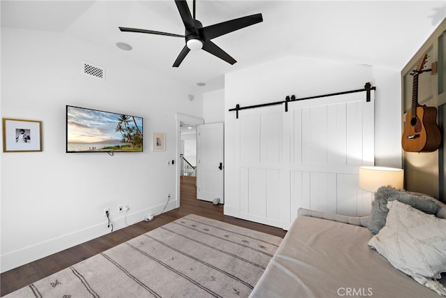 14 Belaire, Laguna Niguel, CA 92677 - bedroom with a barn door, a ceiling fan, baseboards, wood finished floors, and vaulted ceiling