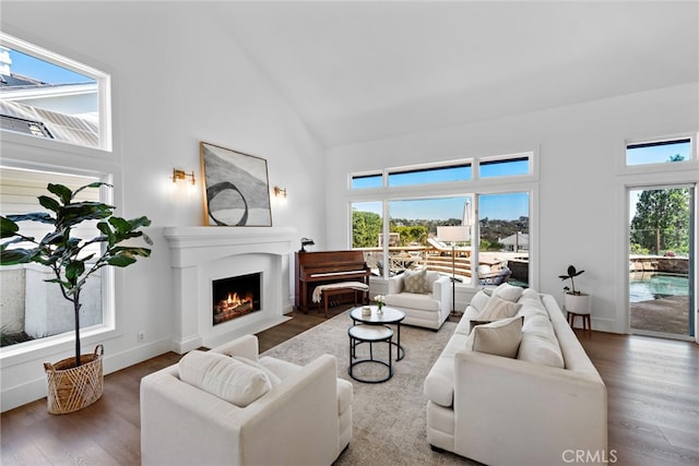 14 Belaire, Laguna Niguel, CA 92677 - living area featuring a fireplace with flush hearth, wood finished floors, and high vaulted ceiling