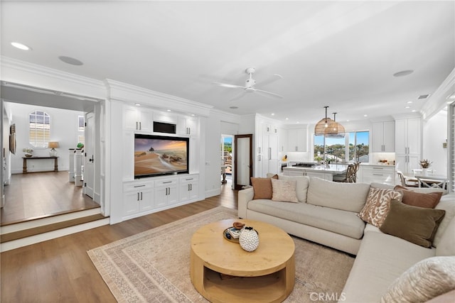 14 Belaire, Laguna Niguel, CA 92677 - living area with recessed lighting, a ceiling fan, ornamental molding, and light wood-style floors