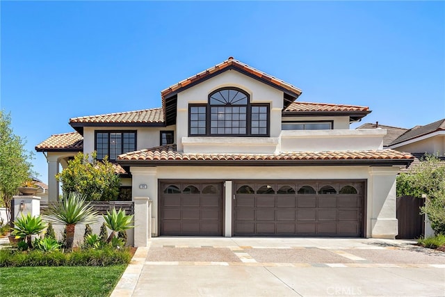 14 Belaire, Laguna Niguel, CA 92677 - mediterranean / spanish-style house with a garage, stucco siding, a tiled roof, and concrete driveway