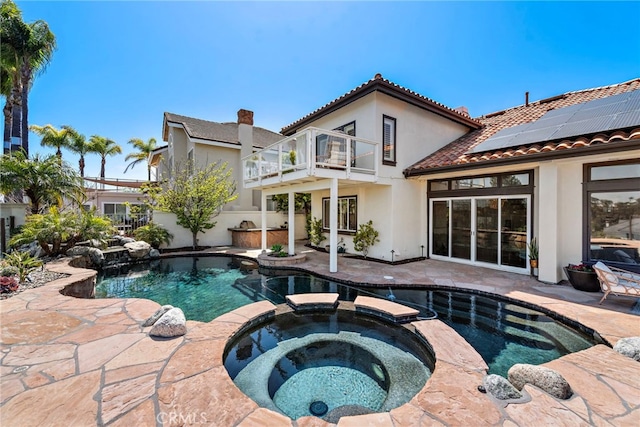 14 Belaire, Laguna Niguel, CA 92677 - rear view of property featuring a patio area, stucco siding, a balcony, and solar panels