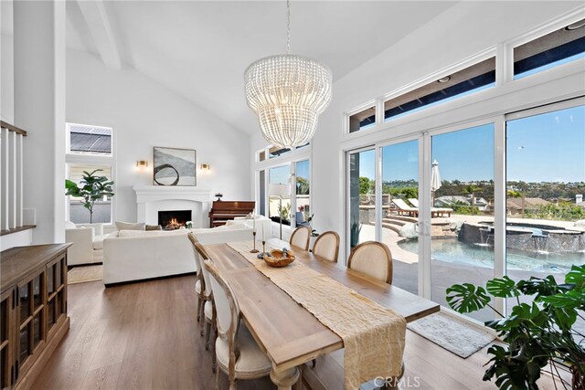 14 Belaire, Laguna Niguel, CA 92677 - dining space with plenty of natural light, wood finished floors, high vaulted ceiling, and an inviting chandelier