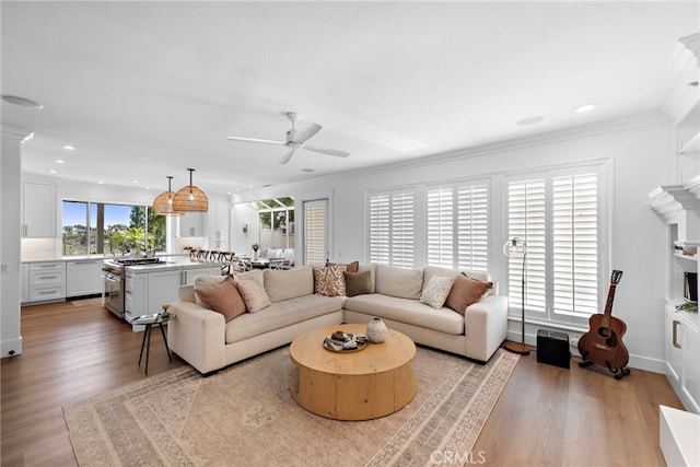 14 Belaire, Laguna Niguel, CA 92677 - living room featuring ceiling fan, ornamental molding, and light wood finished floors