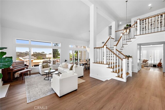 14 Belaire, Laguna Niguel, CA 92677 - living area featuring recessed lighting, a high ceiling, stairs, and wood finished floors