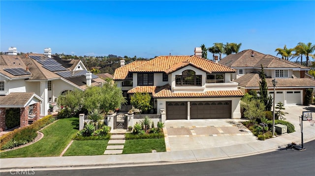 14 Belaire, Laguna Niguel, CA 92677 - mediterranean / spanish house featuring a tiled roof, driveway, fence, an attached garage, and stucco siding