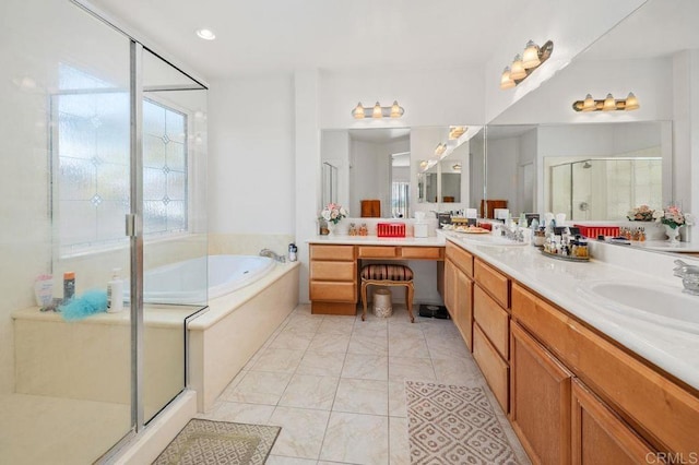 bathroom featuring a sink, double vanity, marble finish floor, a shower stall, and a garden tub