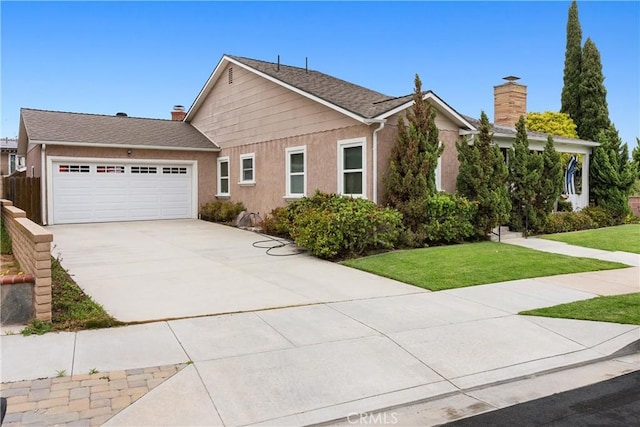 945 10th St, Huntington Beach, CA 92648 - ranch-style home with concrete driveway, a chimney, a front lawn, and a garage