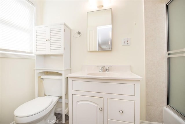 945 10th St, Huntington Beach, CA 92648 - bathroom with vanity, bath / shower combo with glass door, and toilet