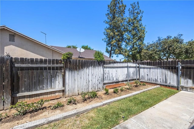 view of yard with a fenced backyard