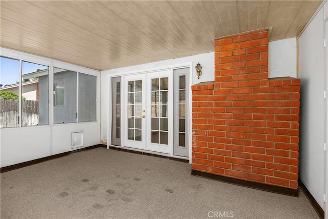 unfurnished sunroom featuring french doors