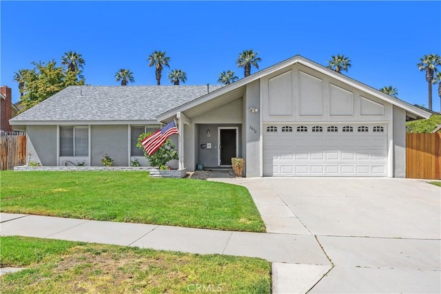 single story home with fence, a front lawn, concrete driveway, an attached garage, and stucco siding