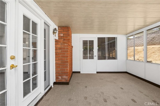 unfurnished sunroom with french doors