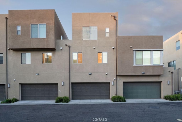 back of house featuring stucco siding