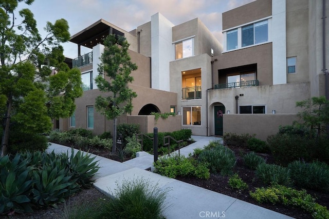view of front of house featuring stucco siding