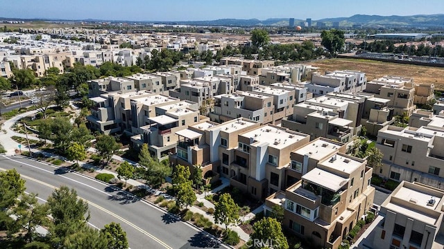 birds eye view of property featuring a mountain view